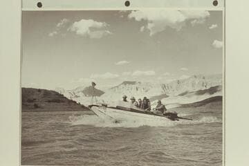 "Esmeralda II" at Pierces Ferry.  The boat had just completed the first motor-powered traverse of the Grand Canyon.Left to right:  Marston; Hudson; Taylor; Edward Hudson; and Robinson.The rig forward is a motion picture camera