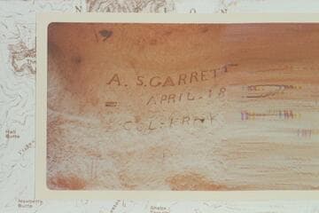 Inscriptions at first Tapeats outcrop by the trail at west side of Hance Canyon