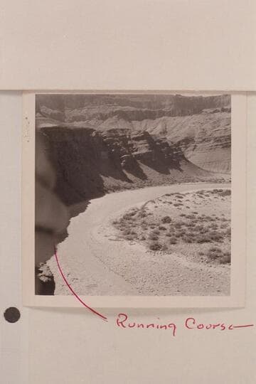 Unkar Rapid at [as]  approximately 60,000 cfs. water runs through boulders on beach [ink notation on photo:  Running Course]
