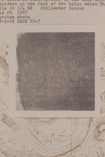Prehistoric inscriptions on the down-river of two large boulders at the foot of the talus below the White Rim; Mile 22 3/4 right bank, Stillwater Canyon