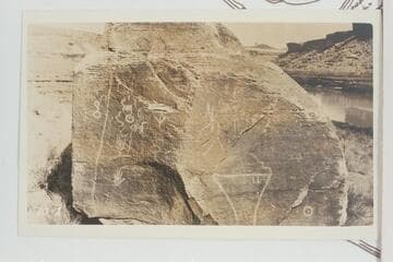 Inscriptions on boulder on flat on right bank at Mile 22 3/4