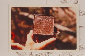 An old tea can found at the old cabin at Mile 69.9 about 100 yards from the left bank