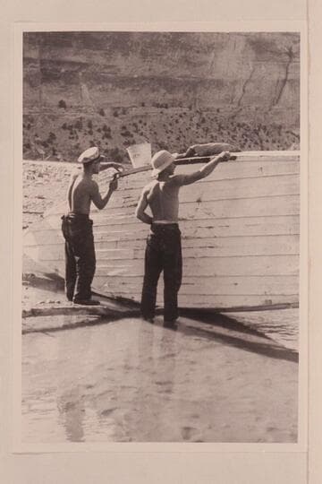 Buzz Holmstrom assists Nevills in boat repair at Pats Hole