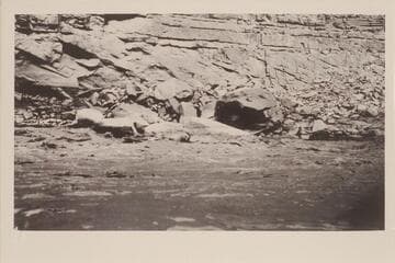 The "Boulder" in Rapid No. 4, Mile 16.7.  Leigh B. Lint, boatman.  R. C. Moore, passenger