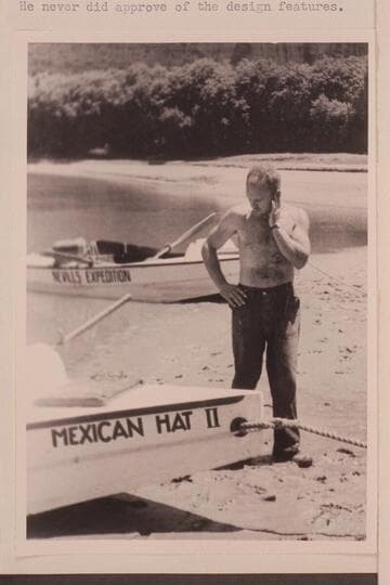 Buzz Holmstrom studying the design of the Nevills Cataract Boats; Pats Hole