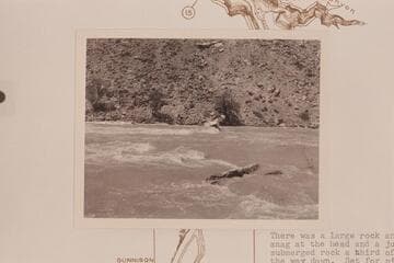 A. K. Renolds hung on a rock in Coal Rapid