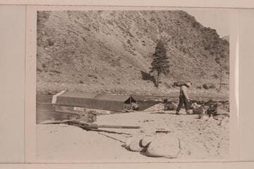 The scow with tent rigged for the night.  The sweeps are on the beach