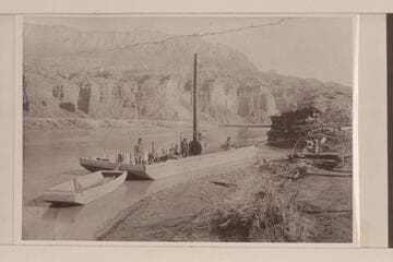 Williams-Cahn placer outfit at mouth of Copper Canyon on the San Juan River.  Jonathan P. Williams at left.  King Henley and Charley Baston at right