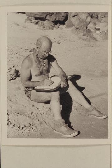 Dock Marston writing the log in the Grand Canyon traverse by motor