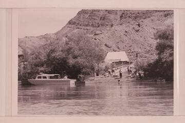 Motorboats at Lees Ferry.  Higgins boat of Bureau of Reclamation at left.  Art Greene's air prop boat at center