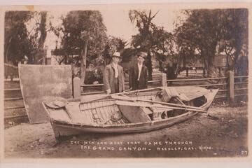 Charles Russell and Ed Monett with the steel boat "Utah" at the end of the trip.  The trip started from Greenriver, Utah, in 1907.  The sheet metal at left is the cover for the after section of the boat