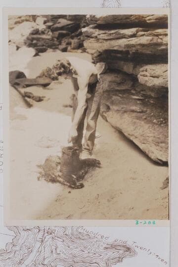 Royce Mowrey struggles with the coffee pot at the noon stop below Rossil Rapid