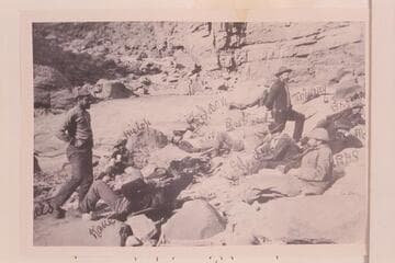 "A Noonday Rest in Marble Canon.  Showing Well the Head of a Fall."  Left to right:  Travers, Hislop, Kane, Gibson, Ballard, Edwards, Twining (standing), Stanton, McDonald, Brown