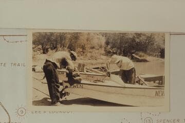 Del Reed and Norm Nevills repairing the "Wen."  Note the hatch fastenings.  Print sent by Barry Goldwater