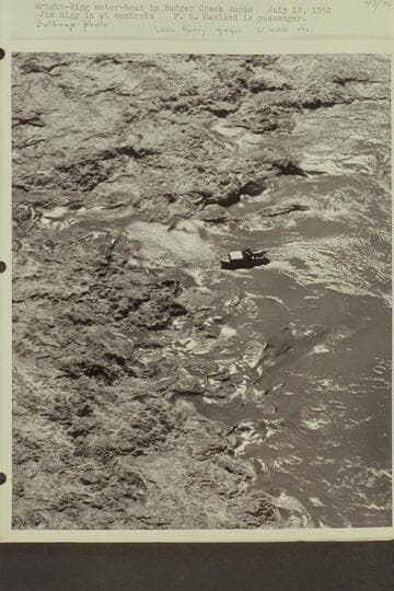 Wright-Rigg motorboat in Badger Creek Rapid.  Jim Rigg is at controls.  F. E. Masland is passenger