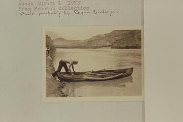 Frank Dodge stepping into the canvas boat "Mojave."  Lees Ferry.  From Freeman collection; probably by Roger Birdseye