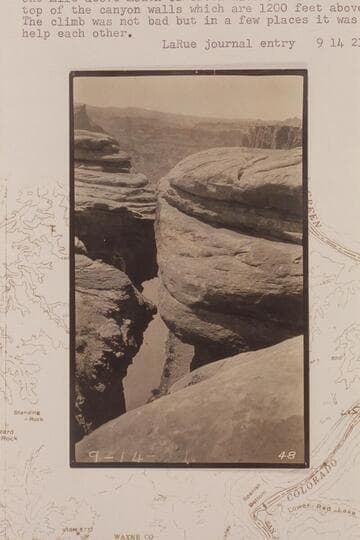 Down from the rim to the Colorado River in Cataract Canyon at approximately Mile 215.  One mile below mouth of Green River