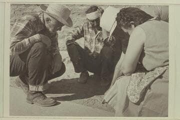 Sketching out the country in Navajo Canyon before riding into it.  Masland at left and Madaleine Cameron at right, Navajo Indian and Marston in rear; at Navajo Mt. Trading Post