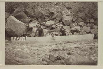 Nevills and Bell work the 16 ft. punt down the shore; San Juan River.  13-Foot Rapid- lining or nosing