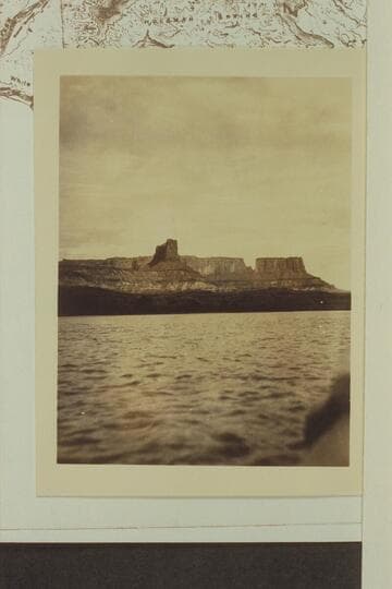 Down Labyrinth Canyon from below Fort Bottom showing the butte off the end of Steer Mesa and Candlestick Tower at left.  Eddy was in this area 1927, June 29, but it is doubtful that his photography is shown in this picture