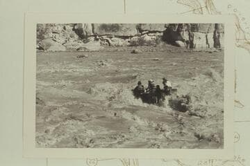 George Stewart's 10-man in Coal Creek Rapid in hole to right of course and with drowned motor.  The craft swung its nose to the left after hitting a rock in the hole as reported by Stewart