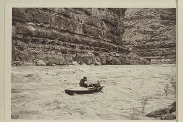 Jack near the bottom of Slickhorn Rapid.  Jack Wimpress in the "Black Submarine" or "Ugh Ptui."