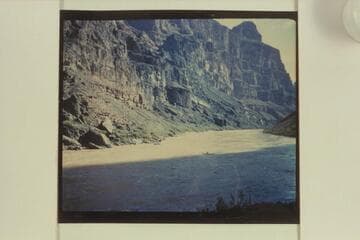 Frank Wright bringing a sadiron down to Vulcan Rapid for portage