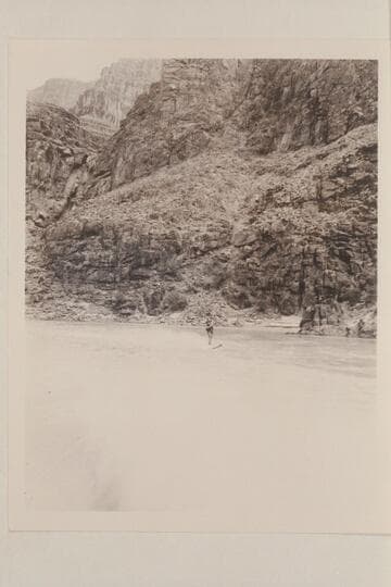 William Gerritt Cooper skiing on the upper end of Lake Mead after traverse of Marble and Grand Canyon with motor boats