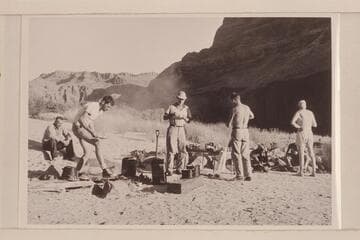 Breakfast at camp at Mile 192.  Chet Bundy, Bill Beer, Ballard Atherton, Hugh Cutler and Joe Desloge.  Hidden by the standing figures are Josh Eisaman and Chuck Richey