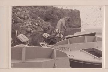 Ballard Atherton pumps the bilge of the "Cactus" at the lagoon in the mouth of Tapeats Creek