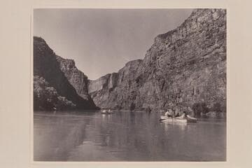 Near the head of Lodore Canyon.  Nevills is the oarsman at the left and Kent Frost is at the right
