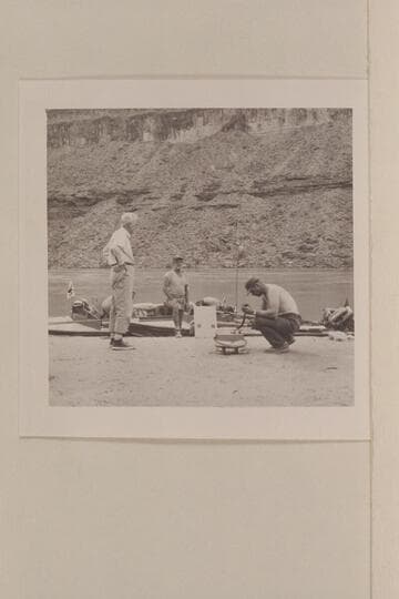 Attempting radio communication with stations on the Rim.  Mile 210 camp.  Desloge; Ballard Atherton; Wallis