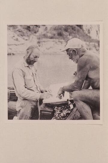 Jim Algar and Dock Marston study script.  Separation Canyon