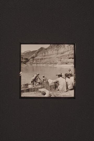 Stowing dunnage on the "Bootoo" at Whitmore Wash.  Marston standing on the boat hides Masland, Argwen Bundy hands dunnage aboard, Hughes and his wife Ila May, watch the proceedings and Joe Eisaman stands at right