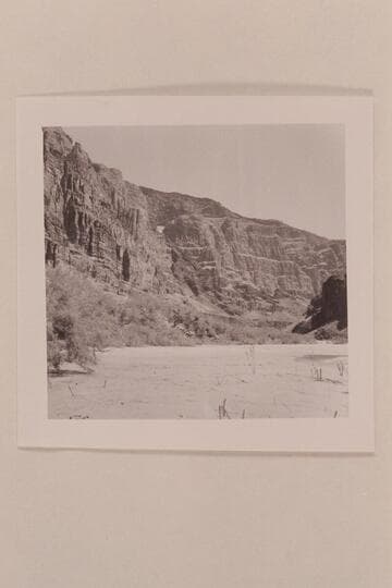Upstream along the right bank from Mile 185.5.  The side canyon is filled with lava