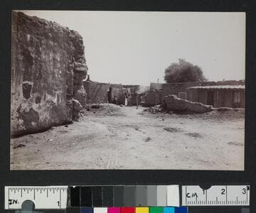 Ruins and adobe houses in an unidentified pueblo or settlement