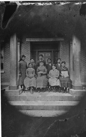 School children photographed on front steps of school