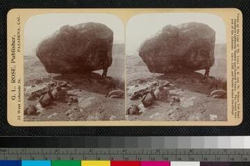 An unidentified man standing next to a boulder, Grand Canyon