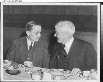 Harry Chandler chats over a meal at his 80th birthday celebration