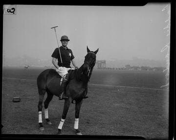 Laddie Sanford on horseback with polo stick