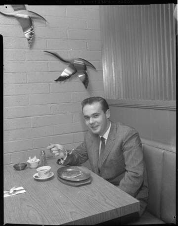 Men eating in a diner