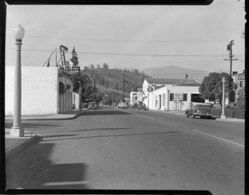 Street scene during the day with 1 variant of same shot at night showing streetlighting