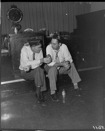Two American Legion members drinking Eastside beer