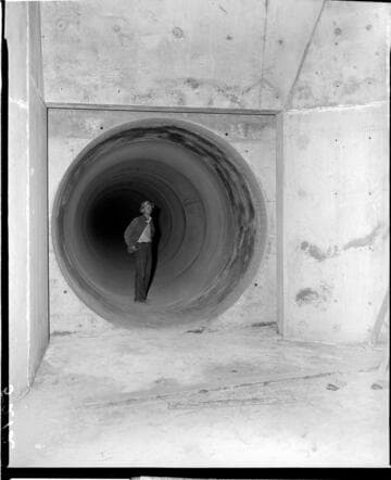 Man standing inside 10+ diameter pipe