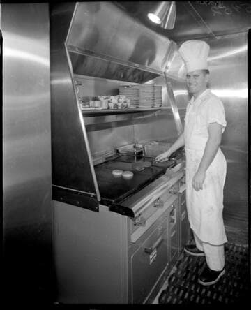 Chef cooking burgers at Jon's restaurant