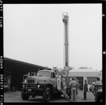 Raising bucket during test at service center