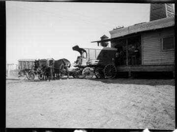 Ice Wagon pulled by team of horses at Imperial Ice Plant loading dock