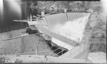 Bear Dam showing trash on spilling crest (ca