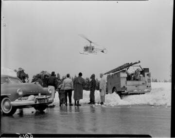 Helicopter taking off for snow survey