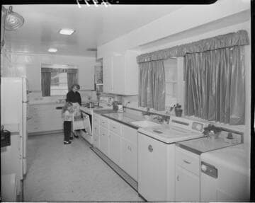 Mother and daughter in all electric kitchen